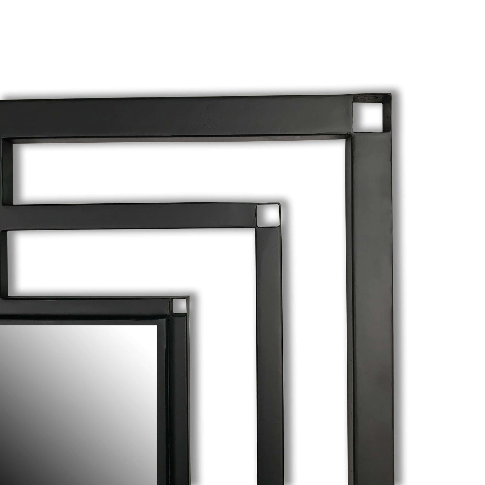 Art deco matte black mirror close up